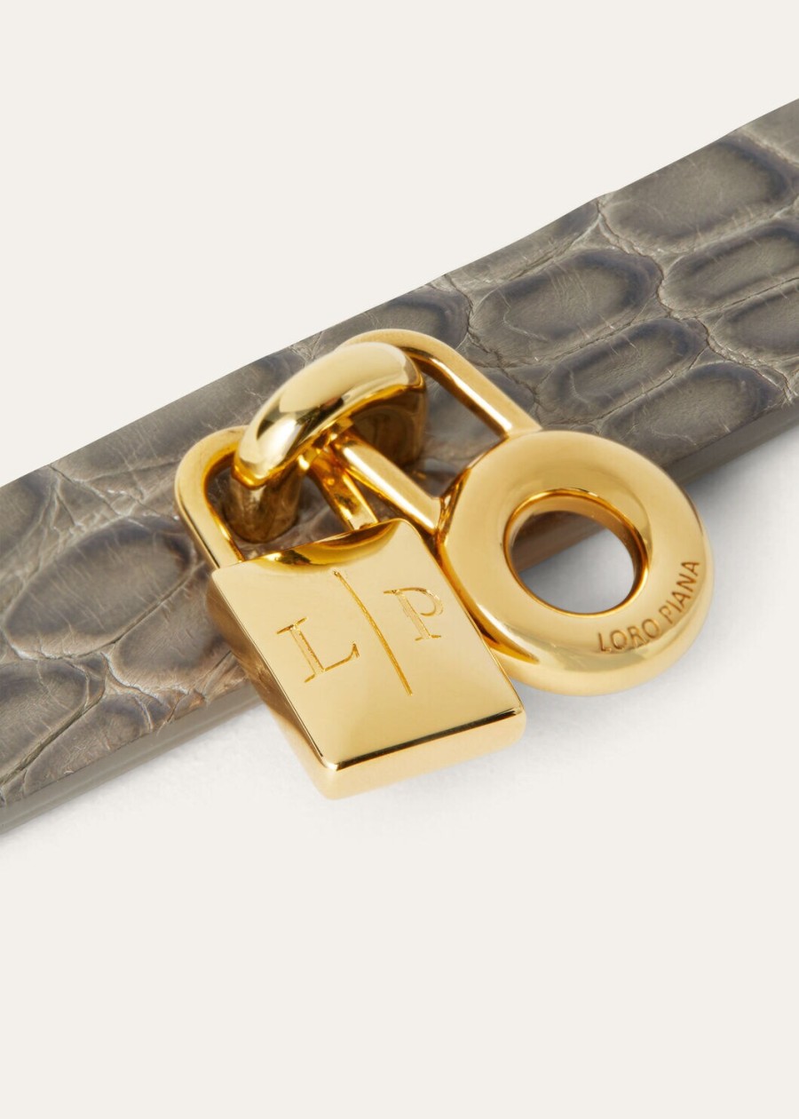 extra bandje van alligatorleer in de kleuren puddle greyjewel sun gold