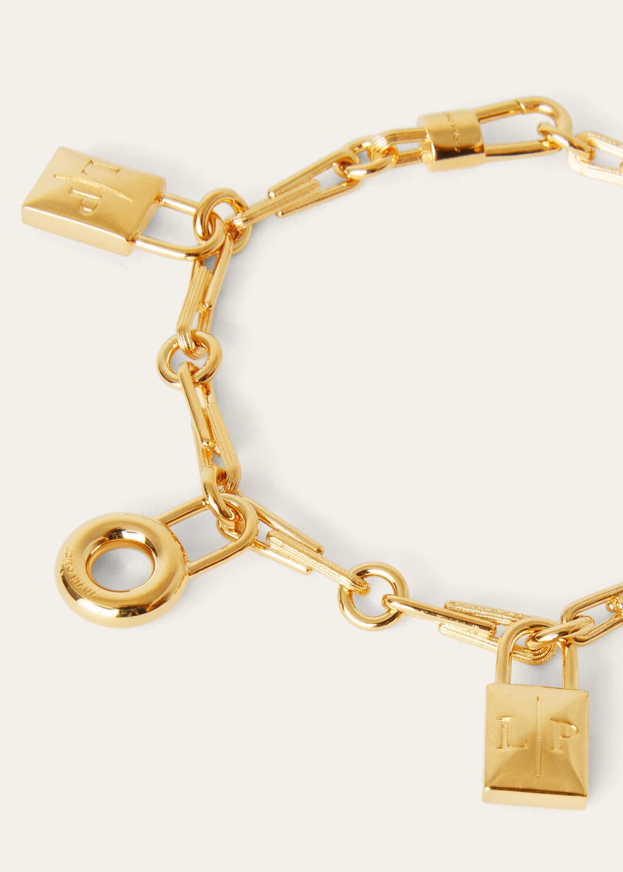 Mijn bedeltjes armband met messing edelsteen en zonmotief in goudkleur