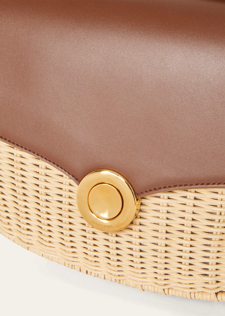 Middelgrote rieten tas met ring van mout/schors.