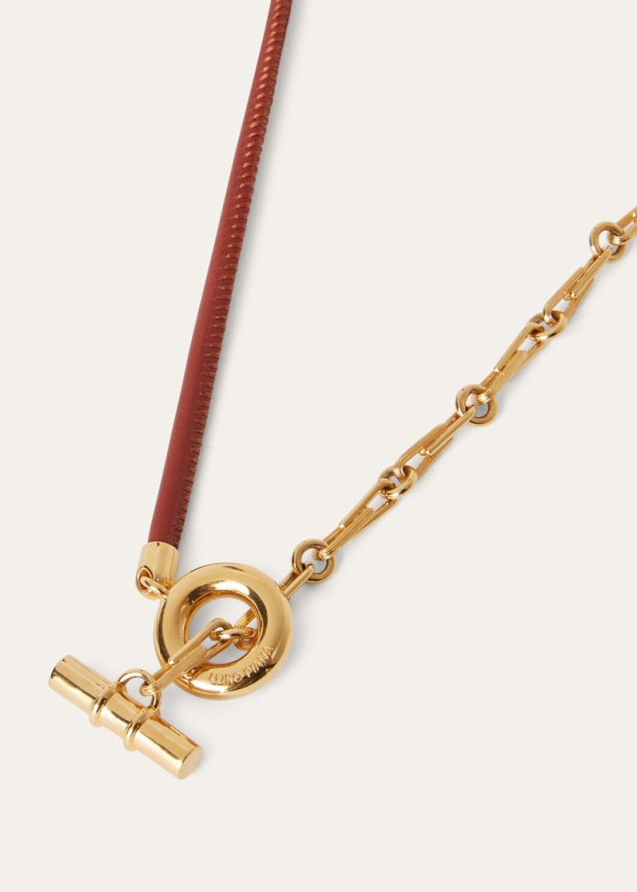 klauwketting van messing met zonmotief in gouddiep kummel-patroon