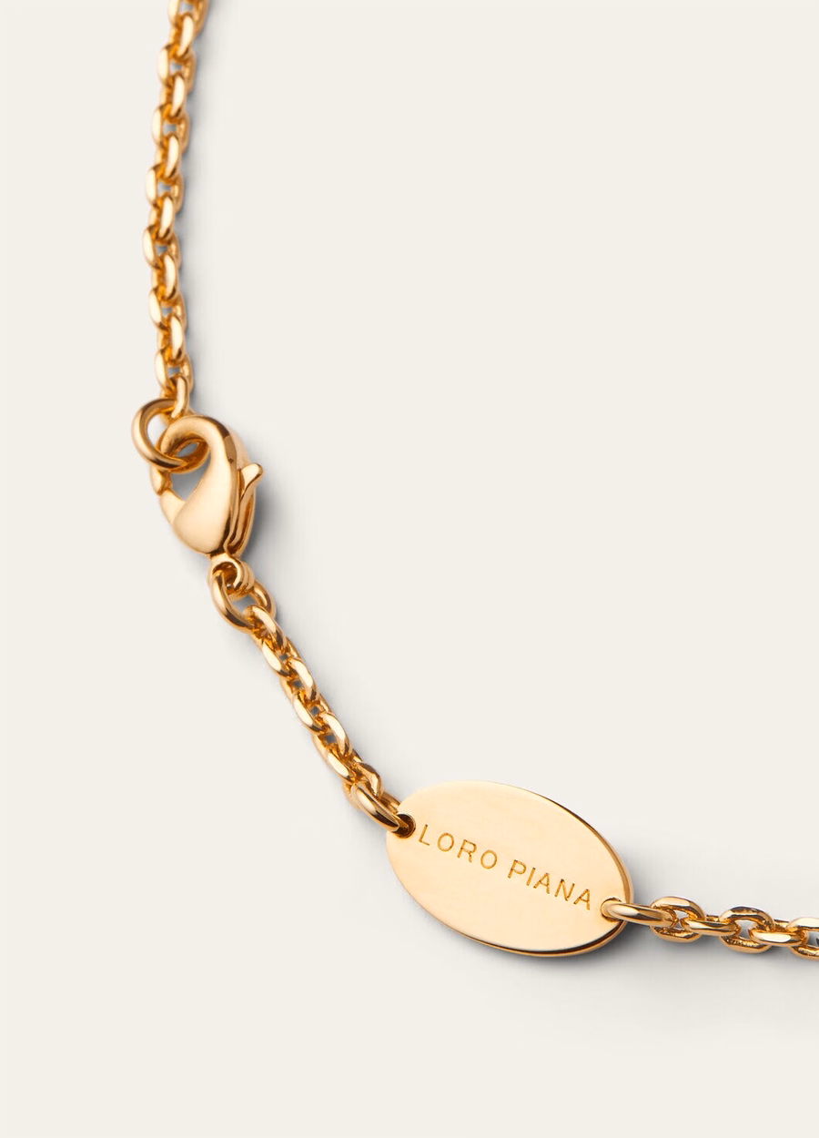 Vicuña ketting van messing met zonnejuweel in goud