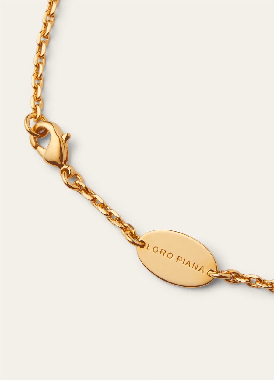 Geitenketting van messing met zonmotief, gouden sieraden