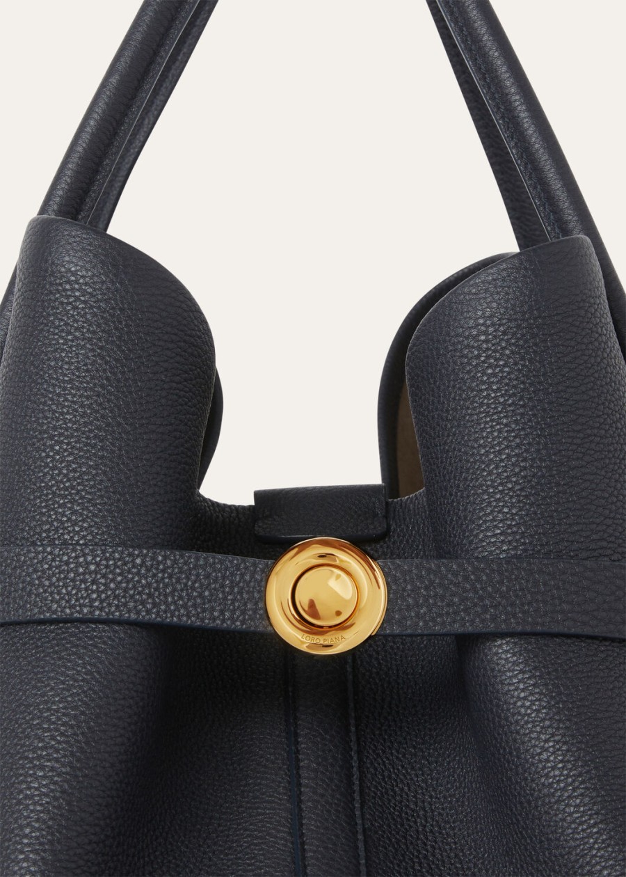 grote shopper ring van kalfsleer in de kleuren blauw marineblauwzonnegoud.
